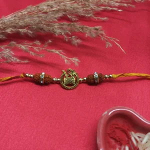 Traditional Rudraksha Om Rakhi with Golden Beads
