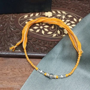 Designer Pearl Rakhi with Roli and Chawal