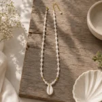 Coastal Beaded Necklace With Cowrie Shell Pendant